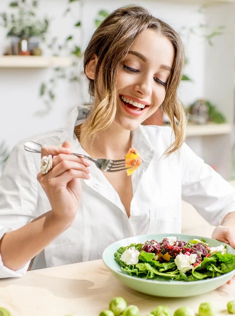 Smiling-girl-eating-scaled